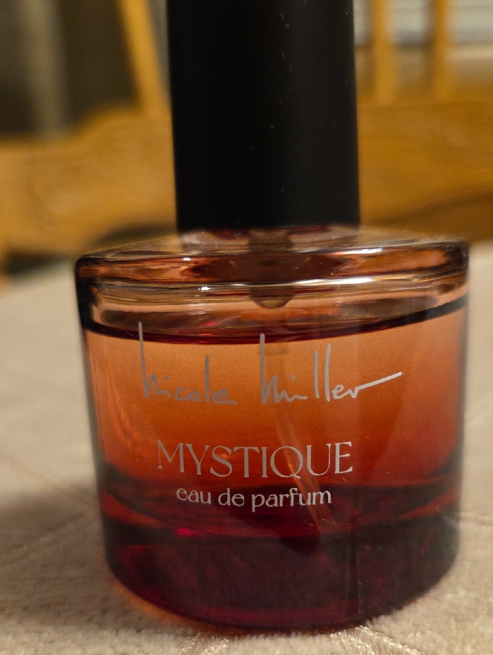Nicole Miller Mystique Gradient Amber-Red Perfume Bottle